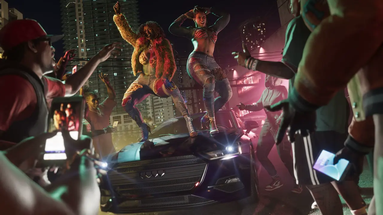 Official Grand Theft Auto VI still of a street party crowd filming on phones around a car