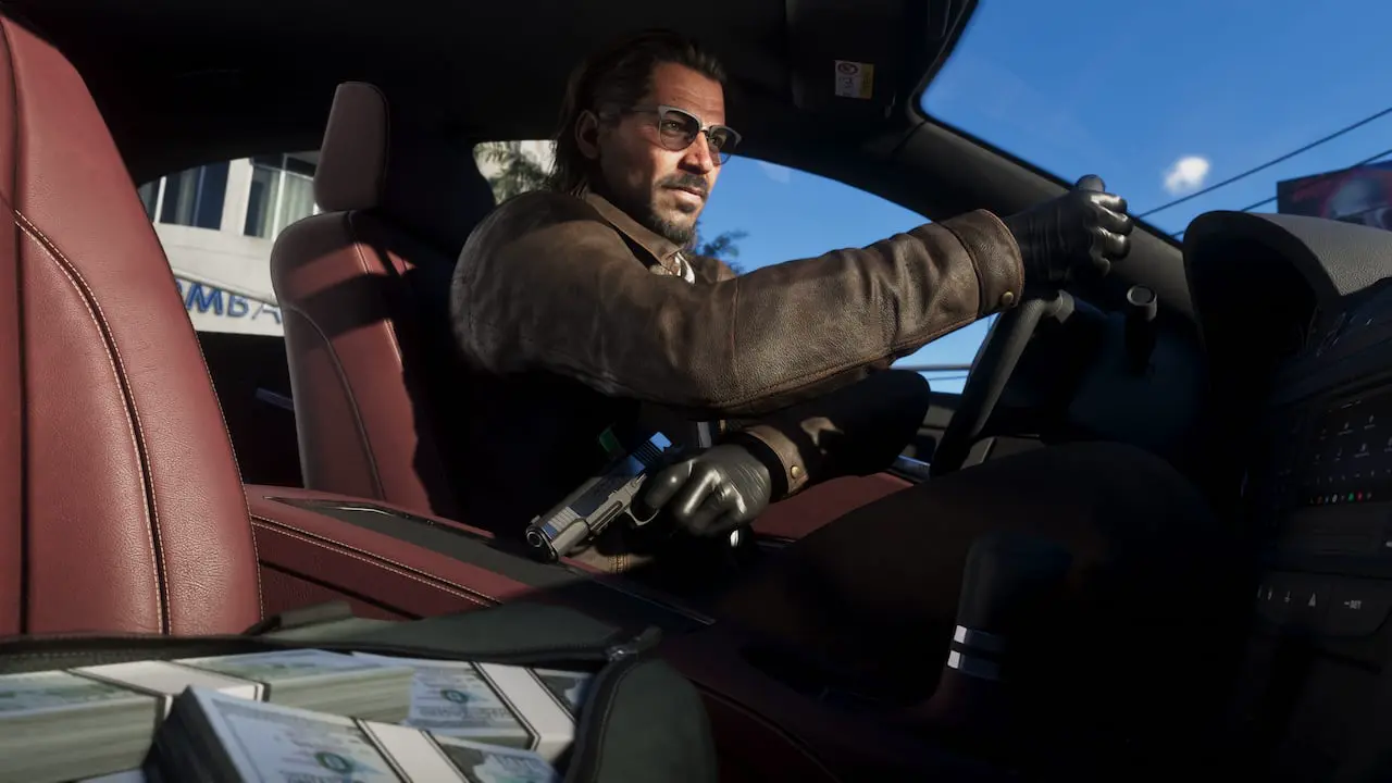 Official Grand Theft Auto VI still of Raul Bautista driving with a pistol and cash on the seat